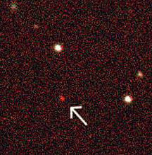 Arrow points to a quasar-activated galaxy at a cosmic redshift of 5.8, imaged during an SDSS session.